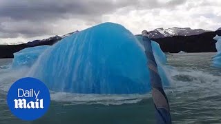 Extraordinary moment massive iceberg explodes next to boat [upl. by Nnov]