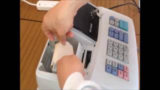 Sharp XEA102 Cash Register How to install a paper roll [upl. by Ainav773]